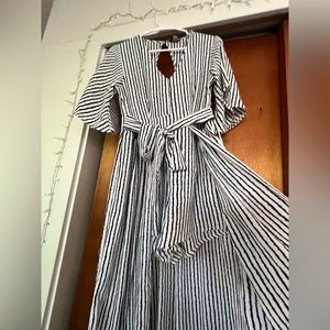 Striped navy and white romper dress. Romper in the front, dress in the back.